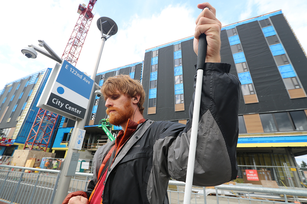 David Bouchard waiting to catch the Max Train at 122nd Avenue