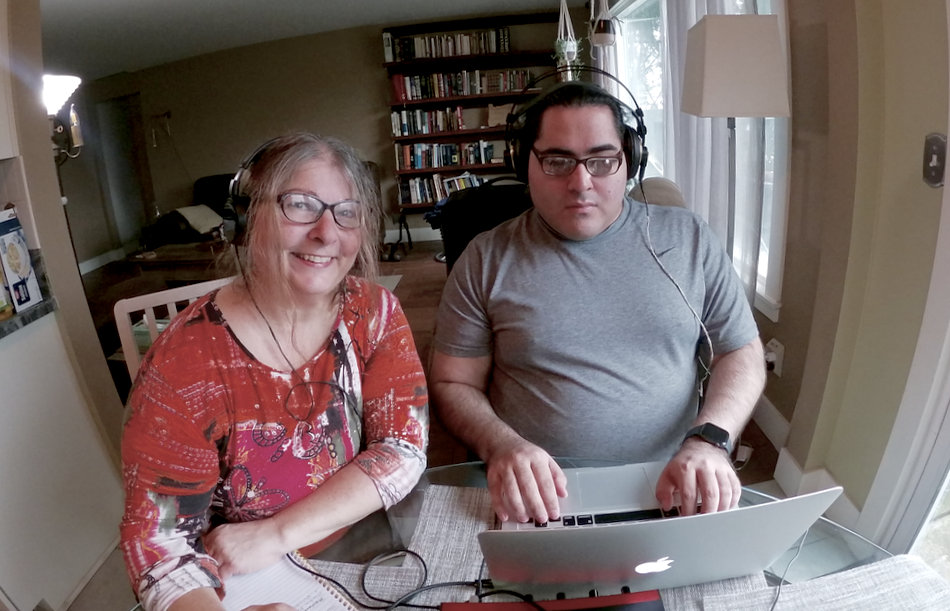 In this photo, Israel Gonzales and I sit at my kitchen table listening the blend that Israel is making using the binaural mic recording and directional mic recording I recorded in Abby's mother's home in Areka, Ethiopia.

