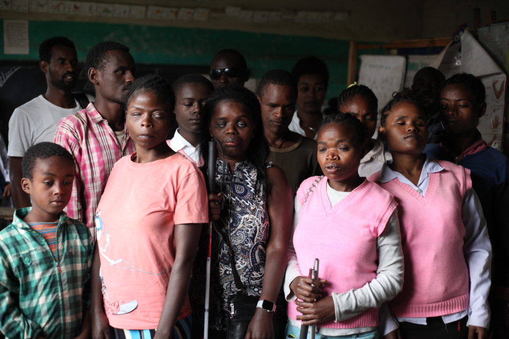 Abby poses with the current students who are blind at Ligaba Primary School, Wolaita Sodo Ethiopia. Photo by Lynnette Oostmeyer